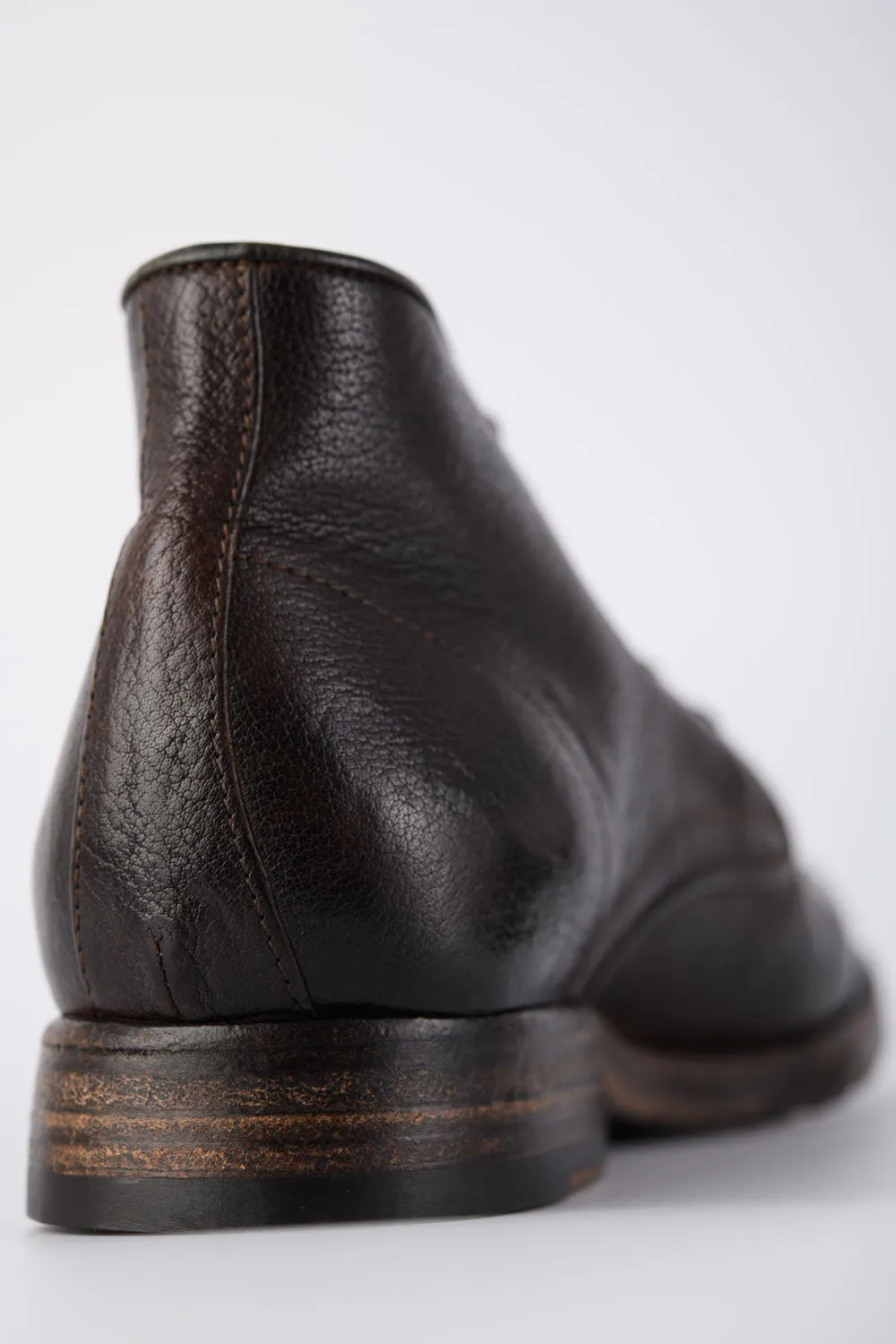 ASTON cigar-brown high chukka boots.