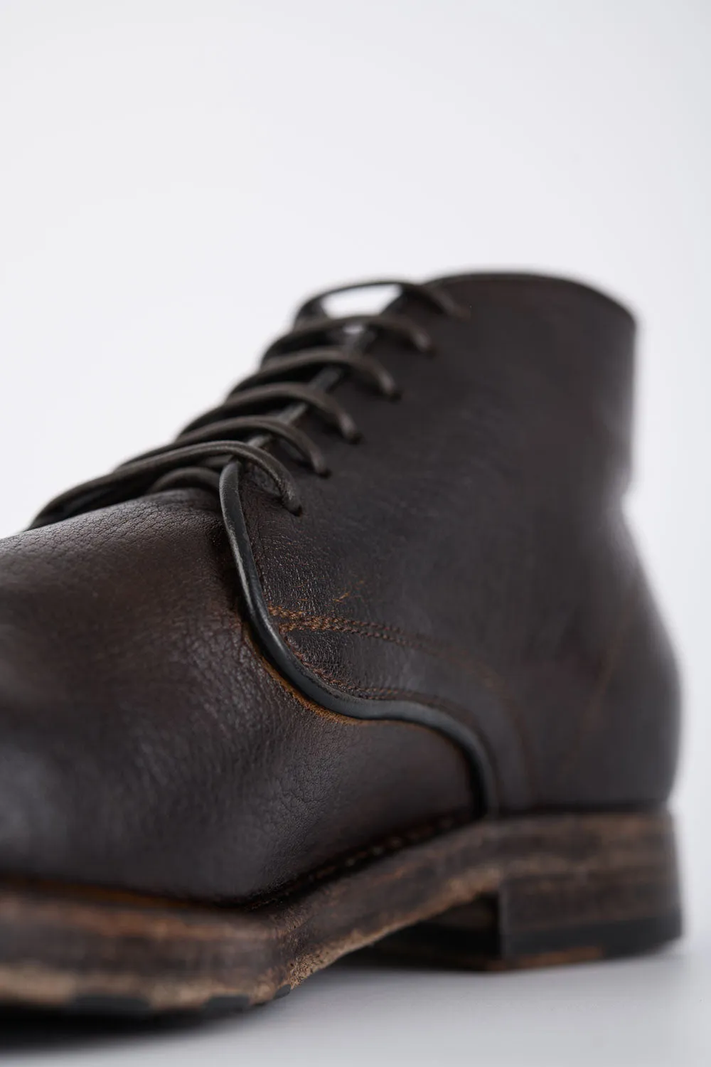 ASTON cigar-brown high chukka boots.