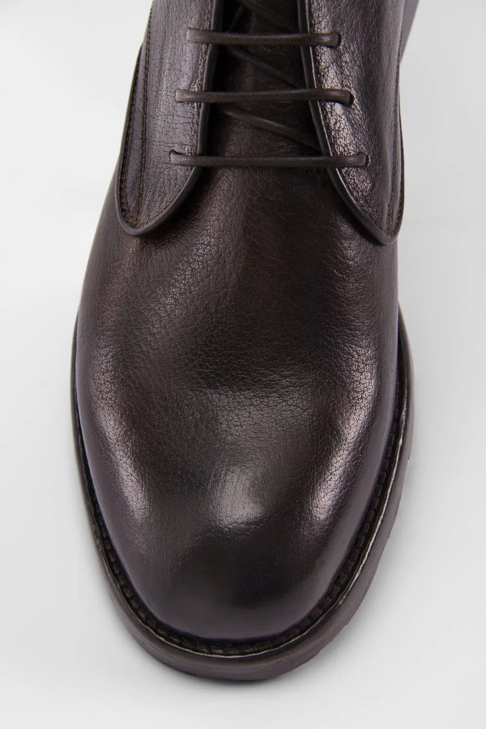 ASTON cigar-brown high chukka boots.