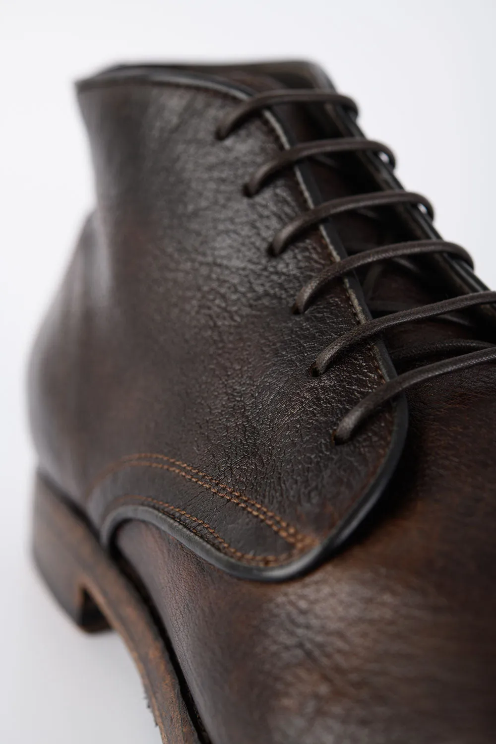 ASTON cigar-brown high chukka boots.